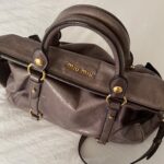 Authentic Grey Looks A Bit Purple In Person Miu Miu Vitello Leather Bow Bag With Gold Hardware And Removable Strap🤎🌆 - Image 24